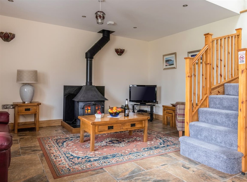 Open plan living space at Cych Cottage in Ponthirwaun, Dyfed