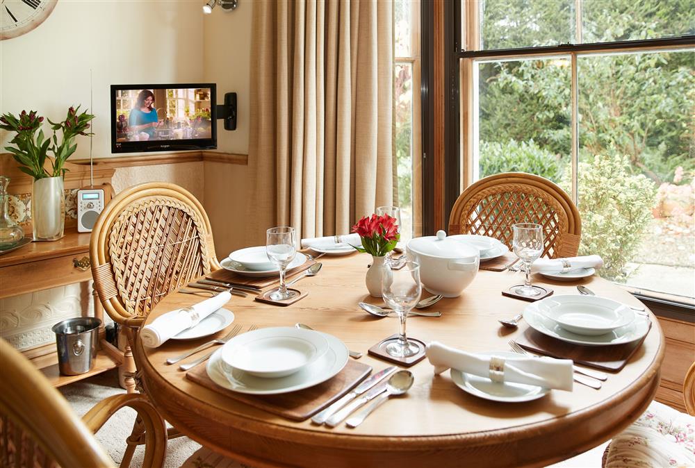 Dining area with garden views at Cygnet Apartment, Harrogate