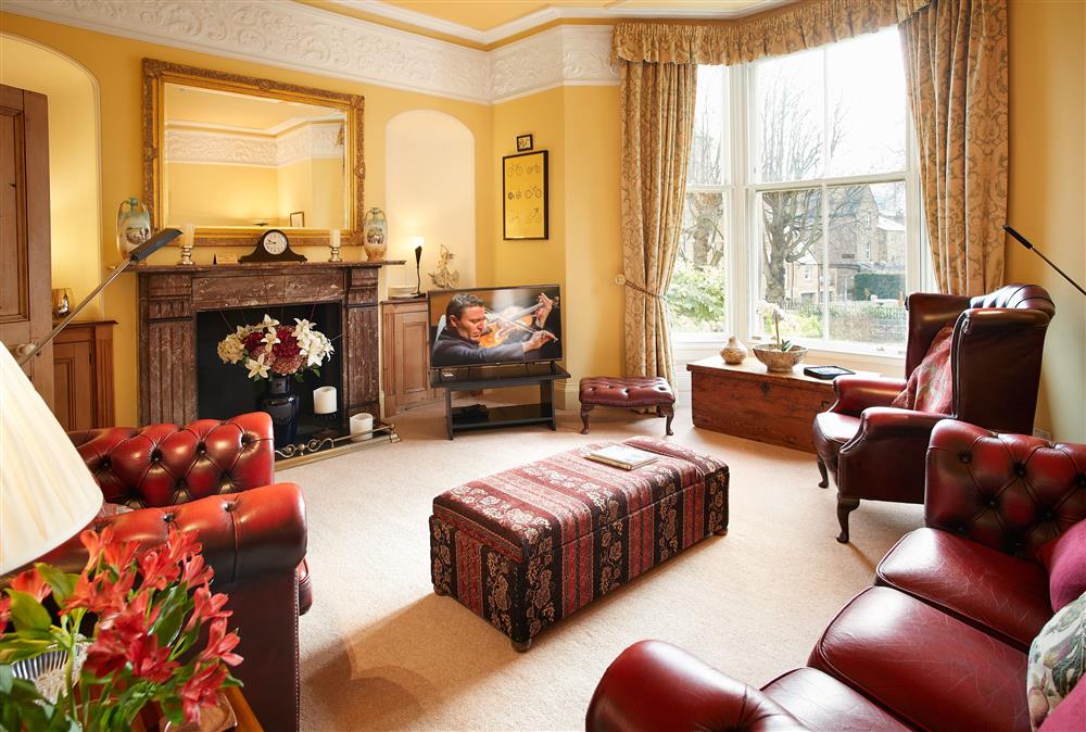 Impressive sitting room with bay window and period features at Cygnet Apartment, Harrogate