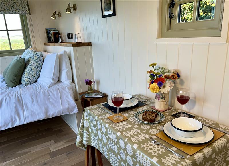 Relax in the living area at Cynefin Shepherds Hut, New Quay