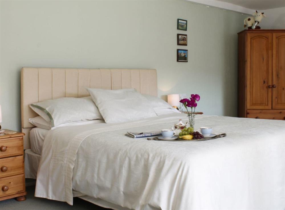 Double bed within family bedroom at Dairy Cottage in Barnstaple, Devon