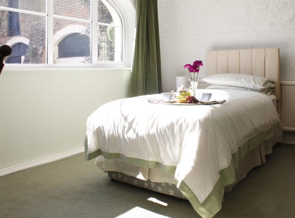 Single child’s bed within family bedroom at Dairy Cottage in Barnstaple, Devon