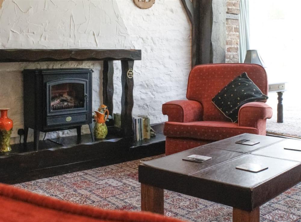 Warm and welcoming living room at Dairy Cottage in Barnstaple, Devon