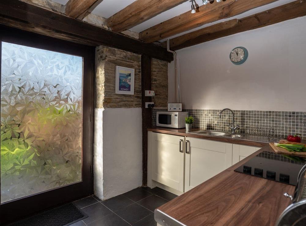 Exposed wood beams throughout at Dairy Cottage in Fowey, Cornwall