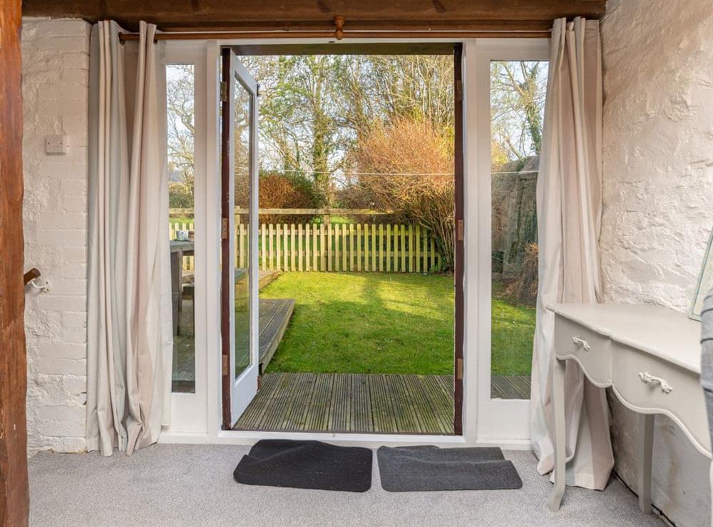 French doors to garden from living room at Dairy Cottage in Fowey, Cornwall