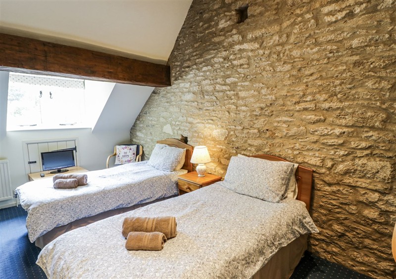 A bedroom in Dairy Cottage at Dairy Cottage, Minster Lovell