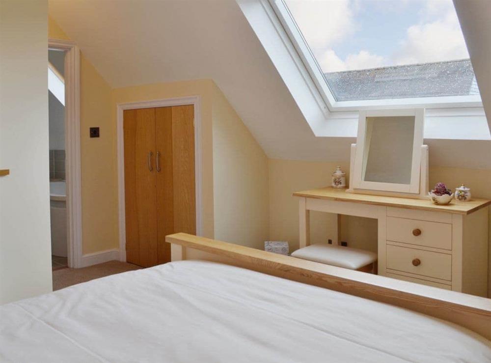 Bright bedroom with Velux window in the sloping ceiling at Dairy Cottage in Pembury, near Tunbridge Wells, Kent