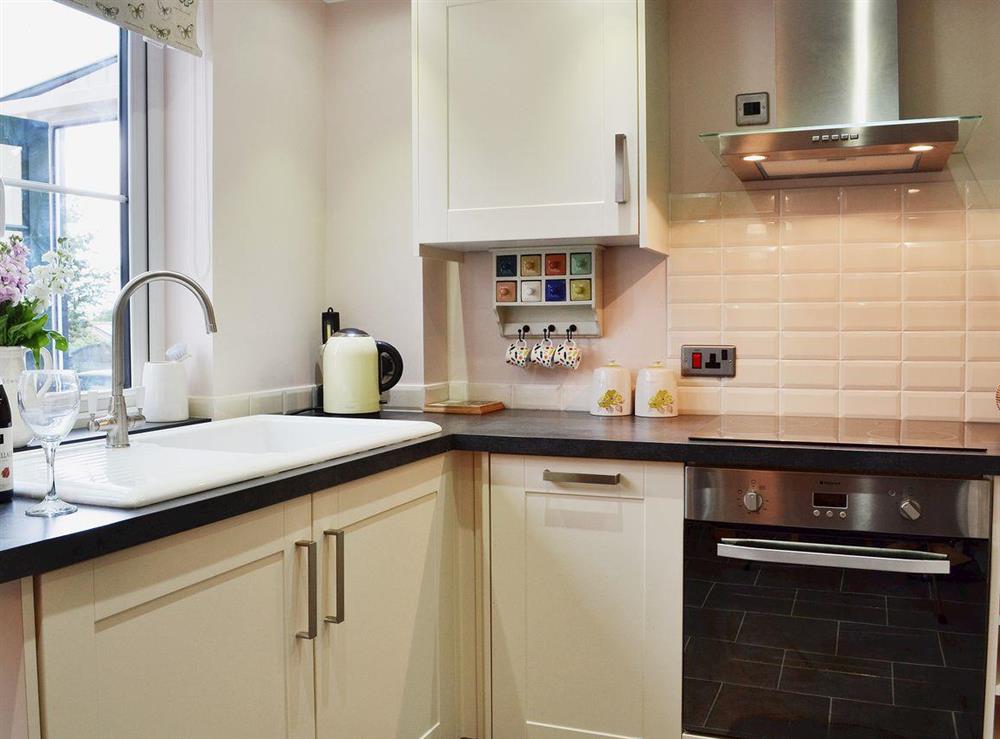 Well-equipped kitchen area with contemporary decor at Dairy Cottage in Pembury, near Tunbridge Wells, Kent