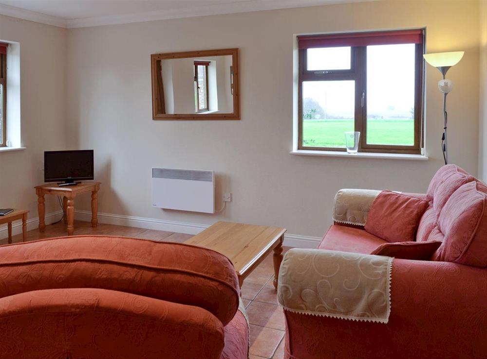 Open plan living/dining room/kitchen (photo 2) at Dairy Cottage in St Osyth, Essex
