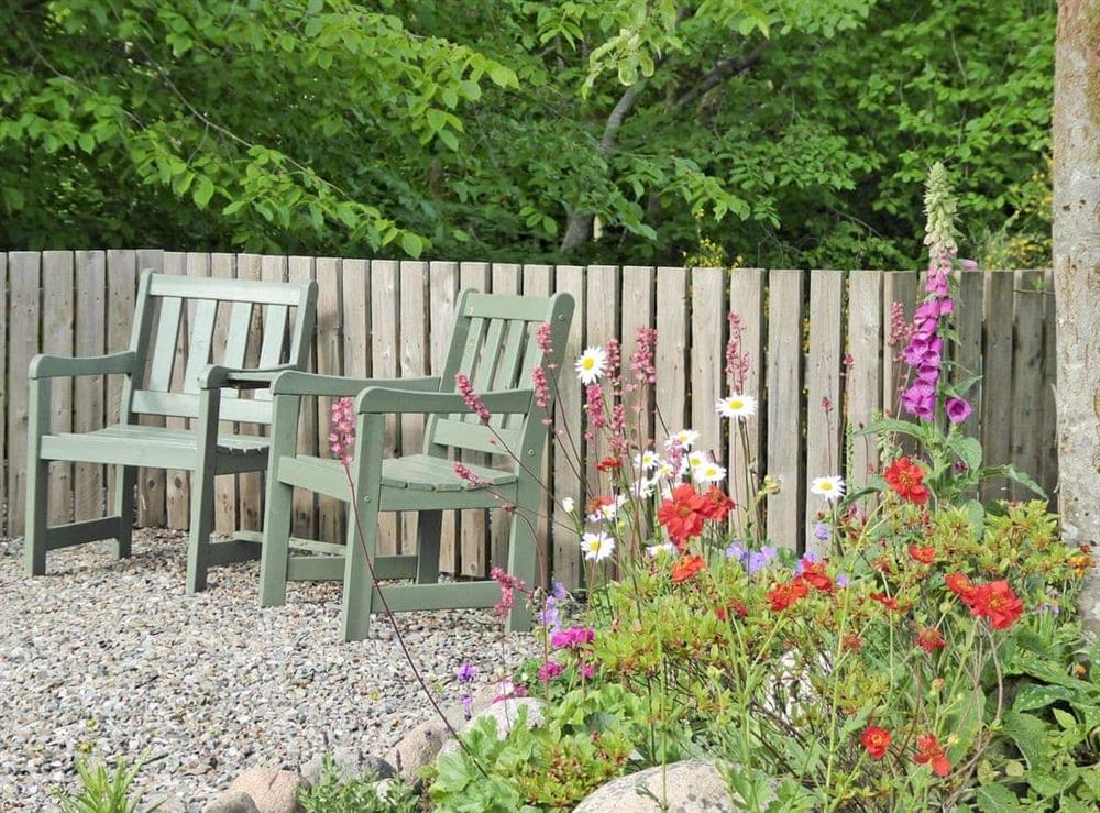 Peaceful garden with sitting-out area (photo 2) at Dairy Cottage in Torlundy, Fort William, Inverness-Shire