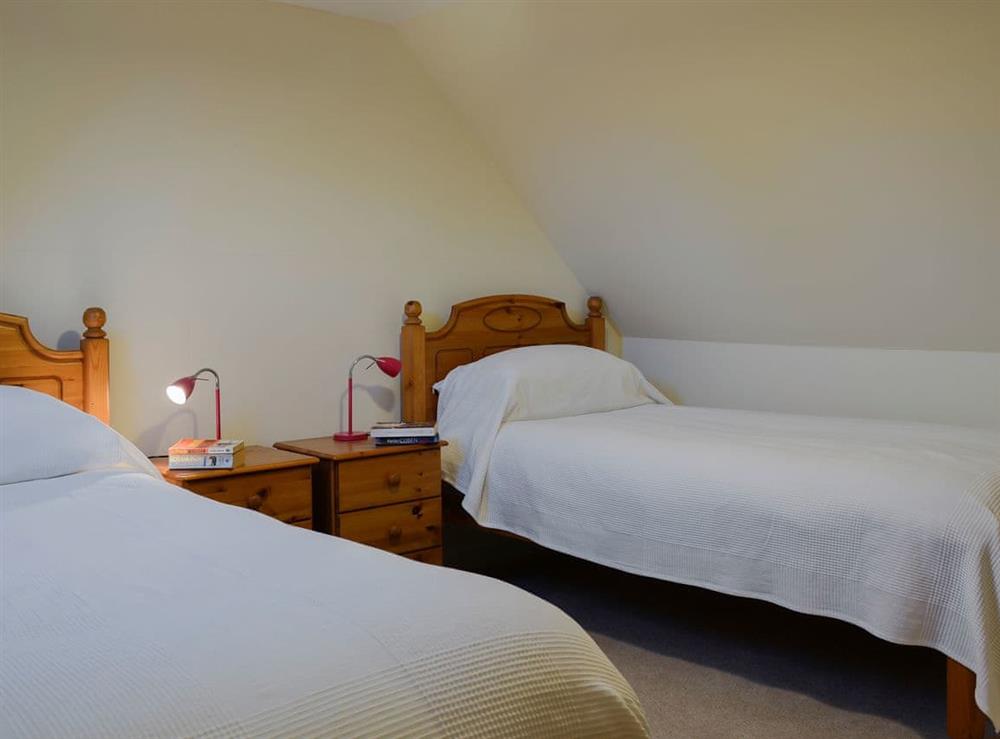 Bedroom with twin beds at Dairy Cottage in Whitehouse, near Alford, Aberdeenshire