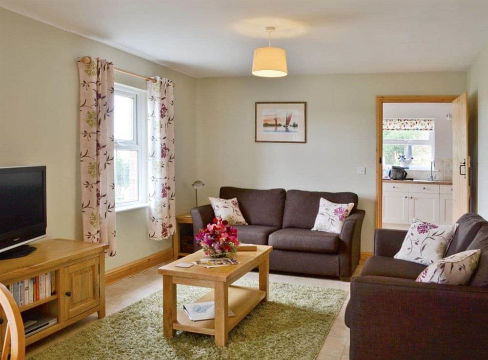 Living room/dining room at Dairy Farm Cottage in West Caister, Norfolk