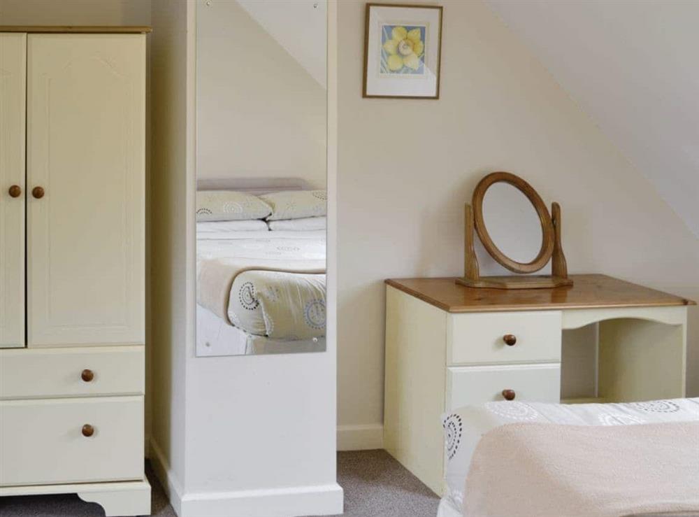 Ample storage and dressing are within double bedroom at Dairy Farm Cottages -Bluebell Cottage in Wootton Fitzpaine, near Charmouth, Dorset