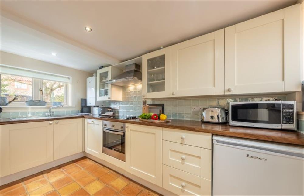 Ground floor: Kitchen with electric cooker, microwave, slimline dishwasher, fridge-freezer and washer-dryer