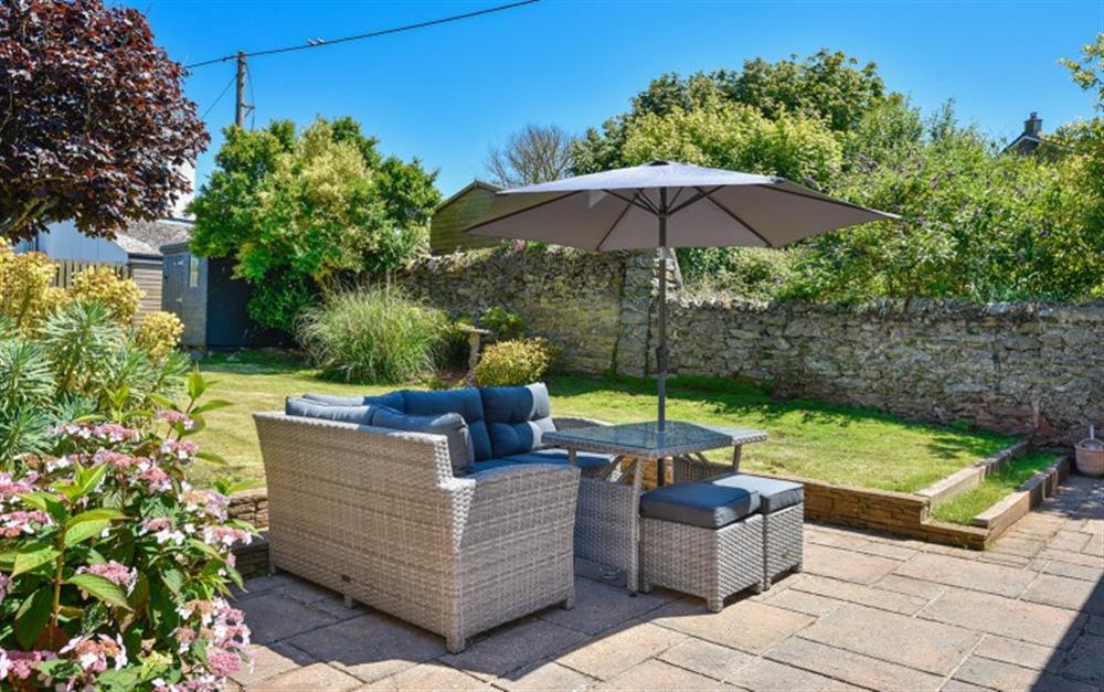 Terrace with outside seating at Daisy Cottage in Malborough