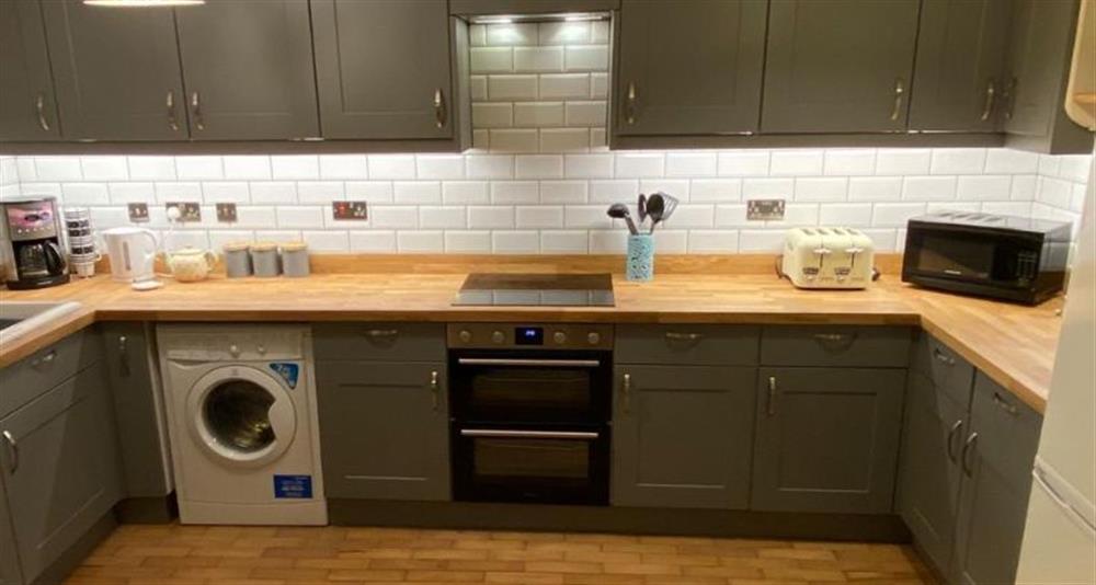 Ground floor:  Well-equipped kitchen (photo 2) at Daisy Cottage, Northrepp near Cromer