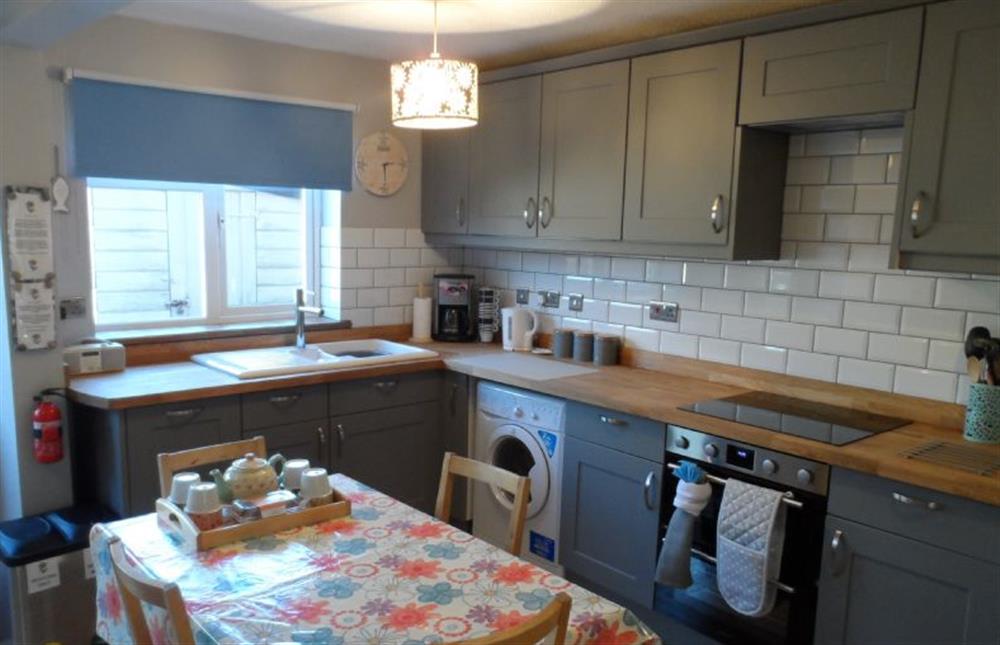 Ground floor:  Well-equipped kitchen and dining area (photo 2) at Daisy Cottage, Northrepp near Cromer