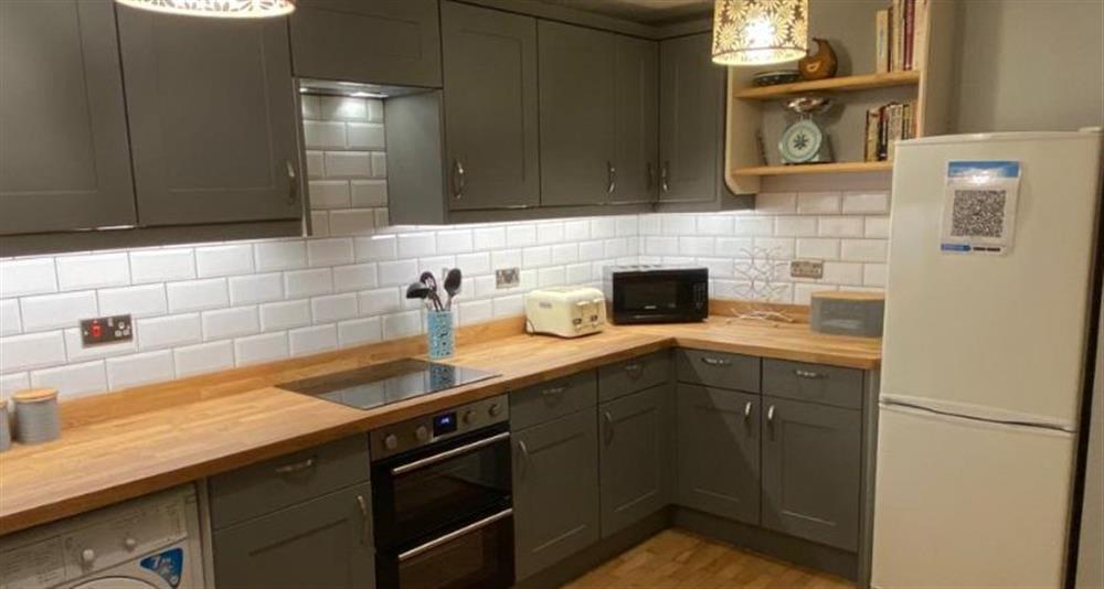 Ground floor:  Well-equipped kitchen at Daisy Cottage, Northrepp near Cromer