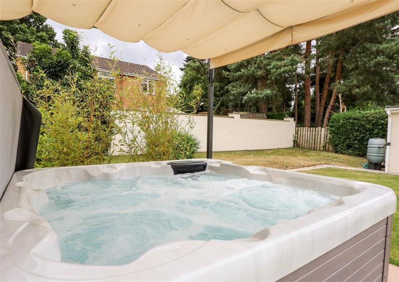 Enjoy the hot tub at Daisy Tree Cottage, Woodhall Spa