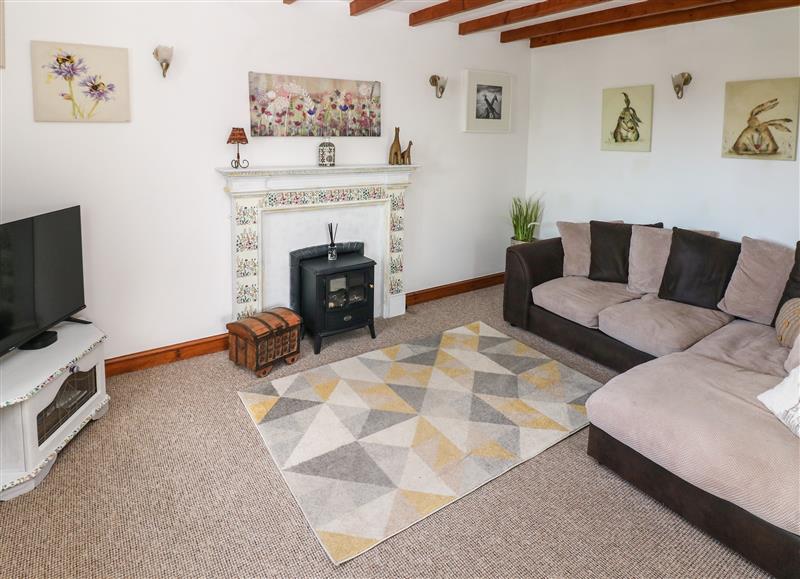Relax in the living area at Daisys Cottage, Pembrey