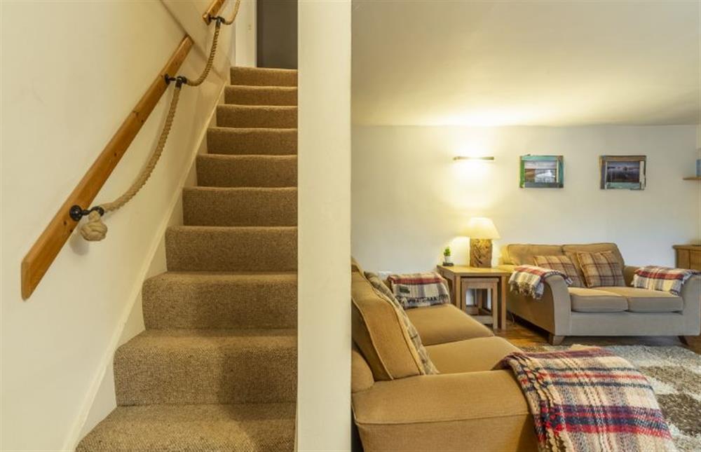 Sitting room and stairs to first floor at Daisys Cottage, Wells-next-the-Sea