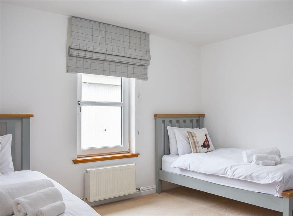 Twin bedroom at Dalbuaick Farm Cottages in Carrbridge, Inverness-Shire