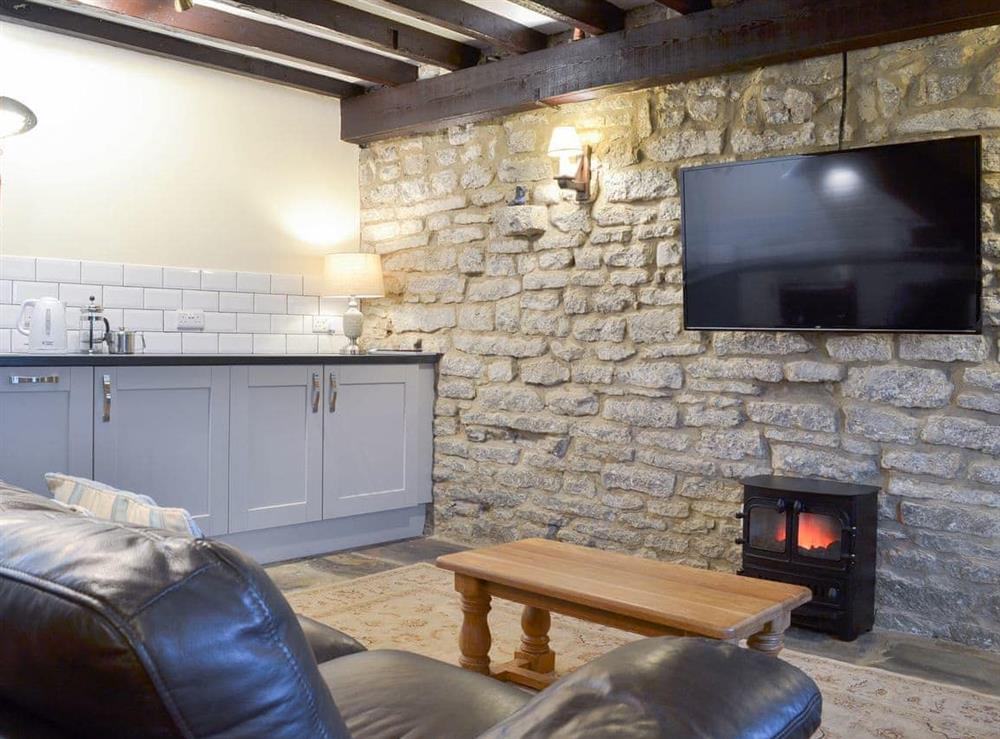 Charming living area with adjacent kitchen at Dale House Farm Cottage in Monyash, near Bakewell, Derbyshire