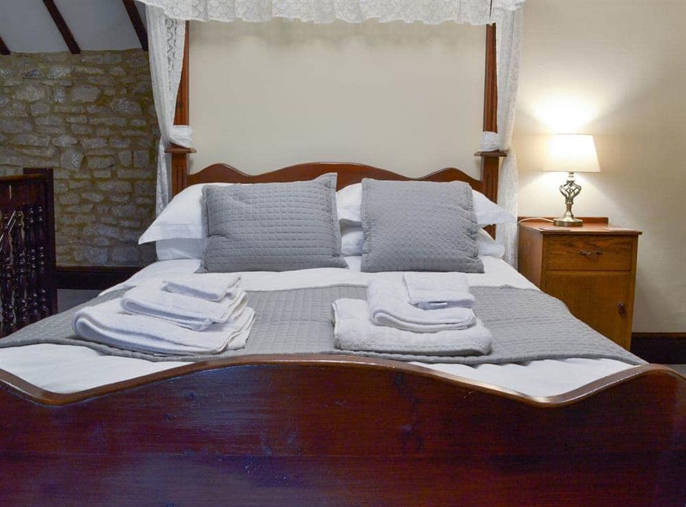 Welcoming and inviting four poster bedded room at Dale House Farm Cottage in Monyash, near Bakewell, Derbyshire