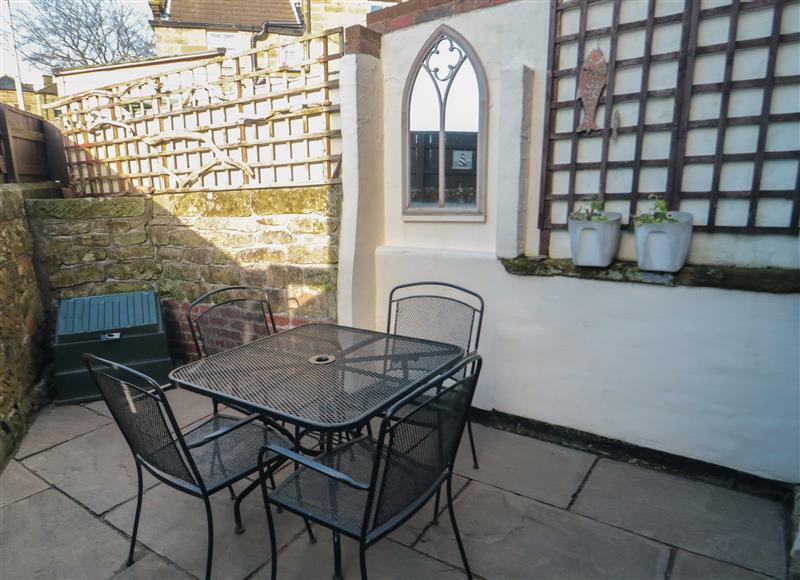 Enjoy a glass of wine on the patio at Dale View, Fylingthorpe