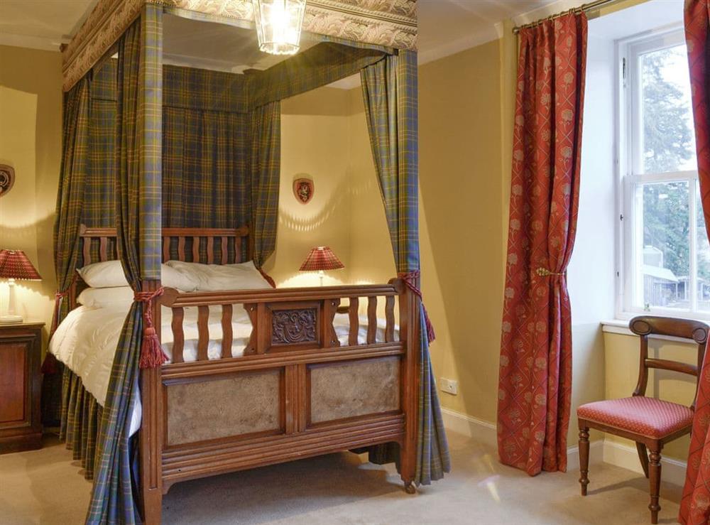 Elegant four poster en suite double bedroom at Dalnaglar Castle, 