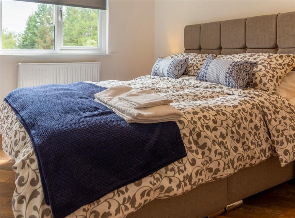 Comfortable bedroom with kingsize bed at Dalnahua in Tighnabruaich, near Colintraive, Argyll and Bute, Scotland