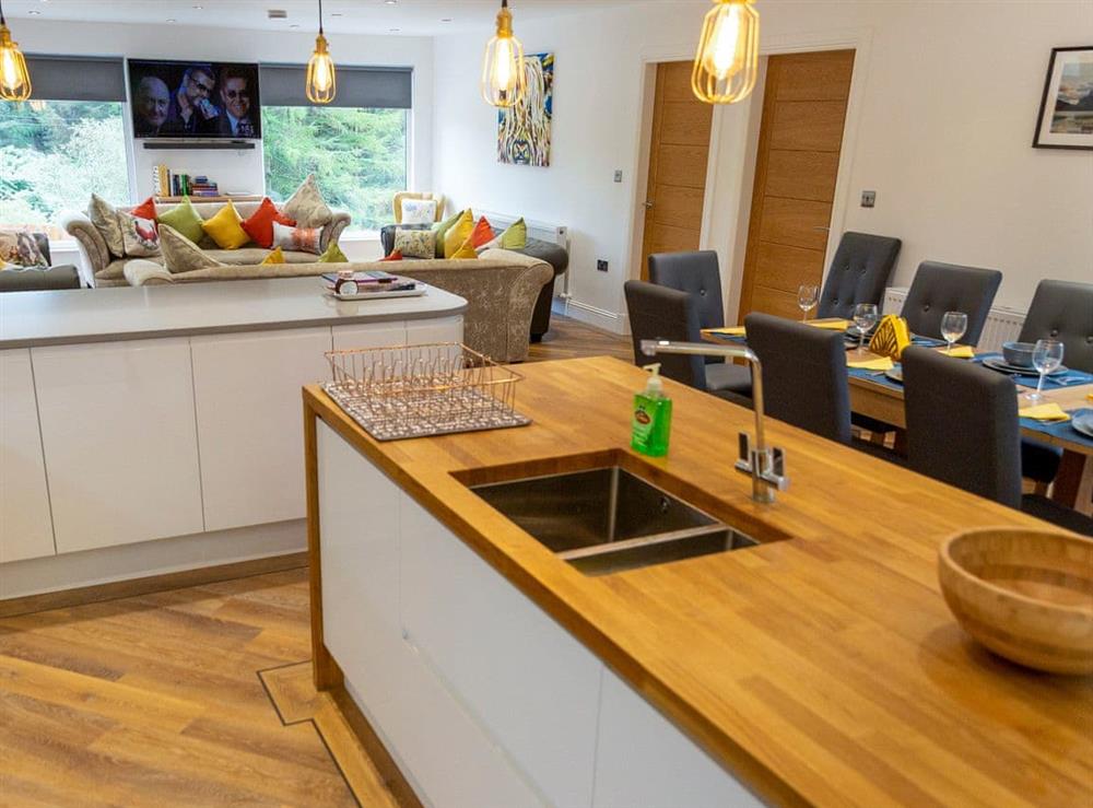 Modern kitchen area with breakfast bar at Dalnahua in Tighnabruaich, near Colintraive, Argyll and Bute, Scotland