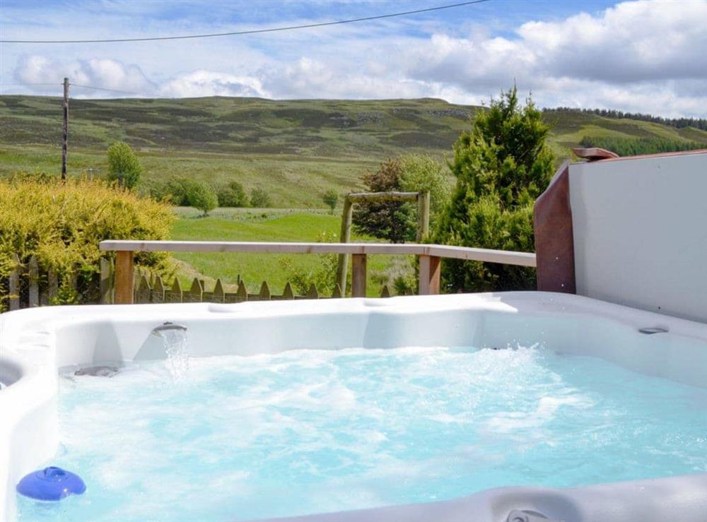 Relaxing hot tub with countryside views at Dalvanie Mill in Blairgowrie, Perthshire