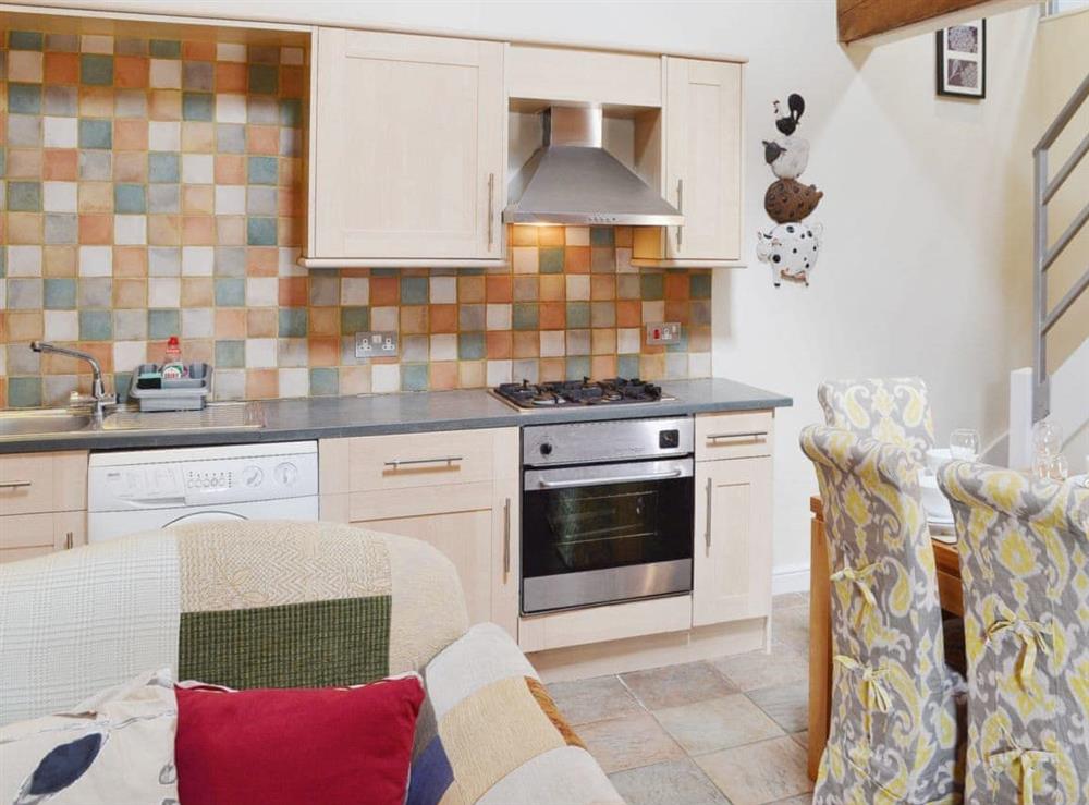 Fully equipped kitchen area with tiled splashbacks at Damsels Bower in Over Haddon, near Bakewell, Derbyshire