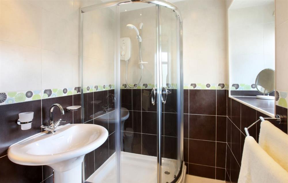 First floor: Fully tiled bathroom with bath, wc and basin at Damson and Orchard, Rainow