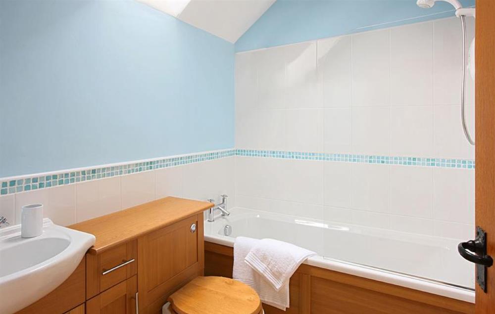 First floor: Fully tiled bathroom with fitted shower, wc and sink at Damson and Orchard, Rainow