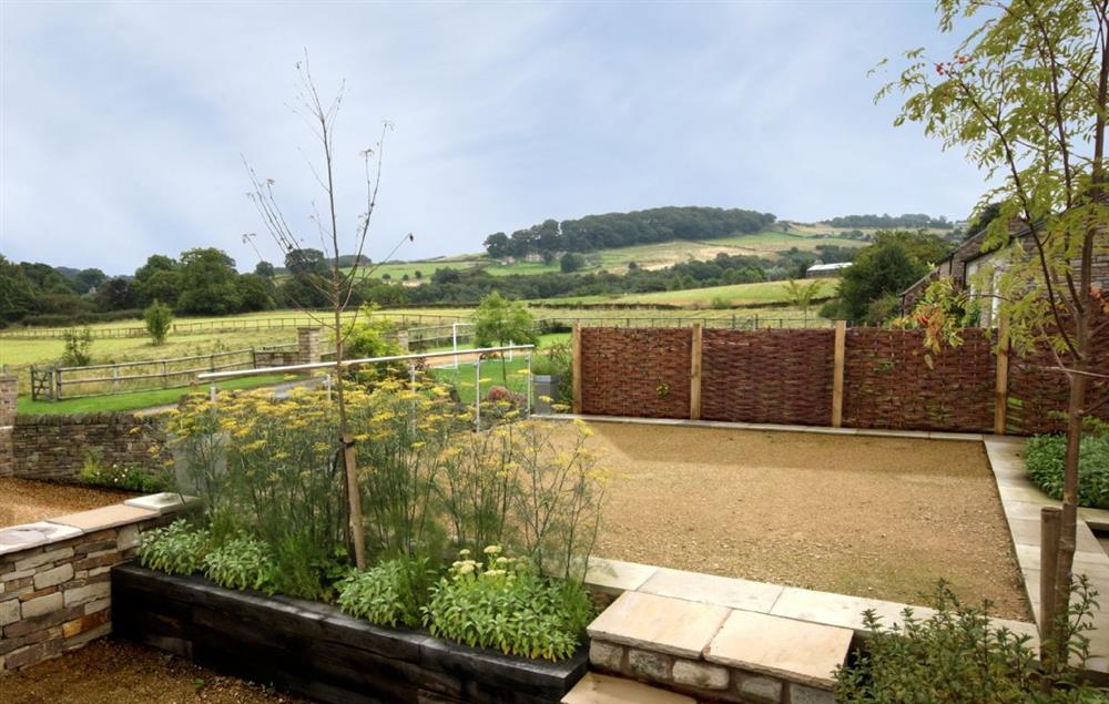 Private garden to the rear with its own patio at Damson Cottage, Rainow