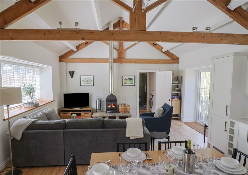 Relax in the living area at Damson Tree Cottage, Charmouth