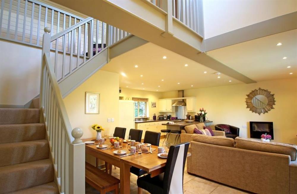 Dining room, living room and stairs to first floor at Damson Tree Cottage, Faversham, Kent