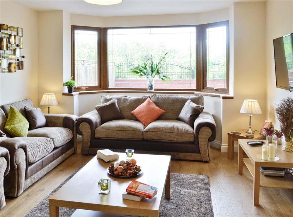 Beautifully presented living room with French doors at Dan-y-Glo in Swansea, West Glamorgan