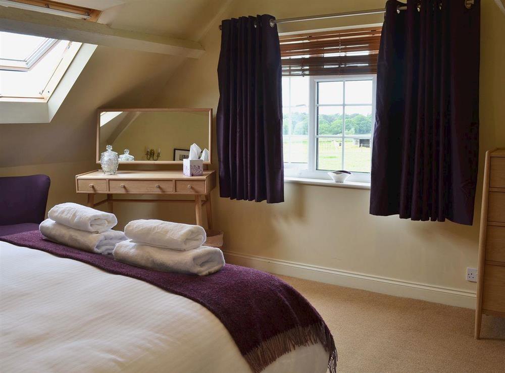 Bedroom with kingsize bed (photo 2) at Daneshurst Cottage in Tiptoe, near Lymington, Hampshire