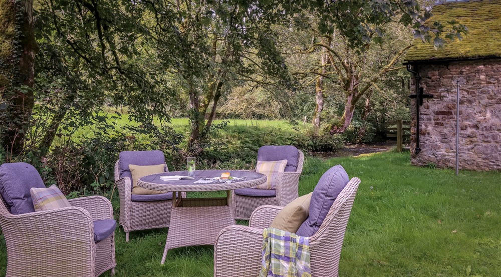 The outdoor seating area by the River Manifold, Derbyshire at Darfar in Nr Ashbourne, Derbyshire