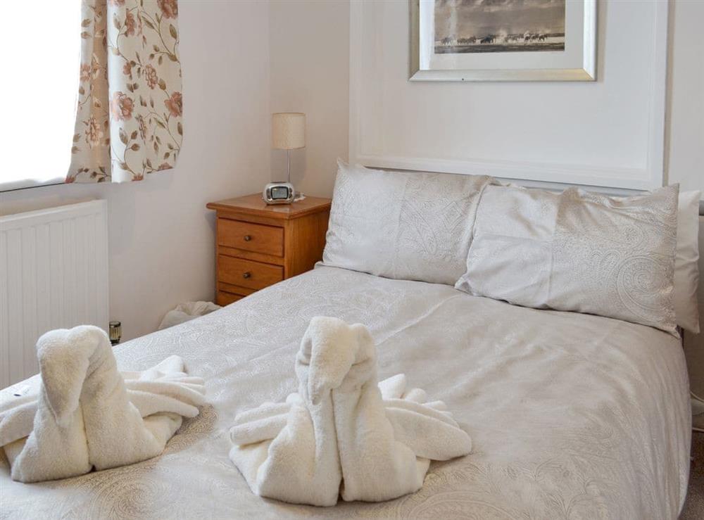 Comfortable ¾ sized double bedroom with chest of drawers at Dart Corner in Bovey Tracey, Devon