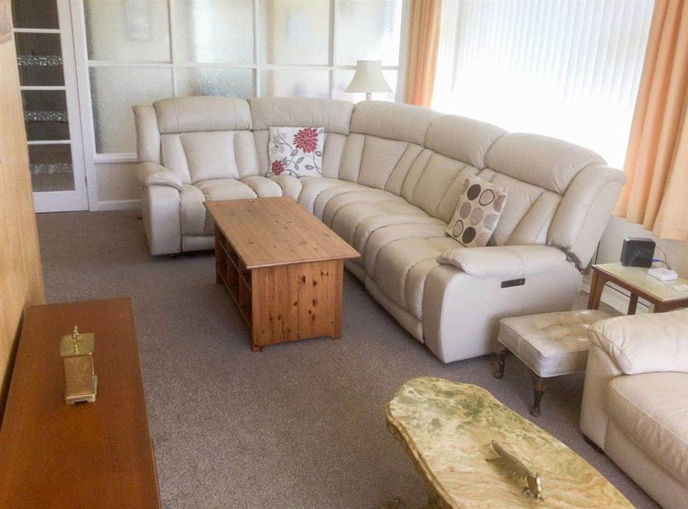 Plentiful seating including leather reclining corner settee with DVD and Freeview TV.