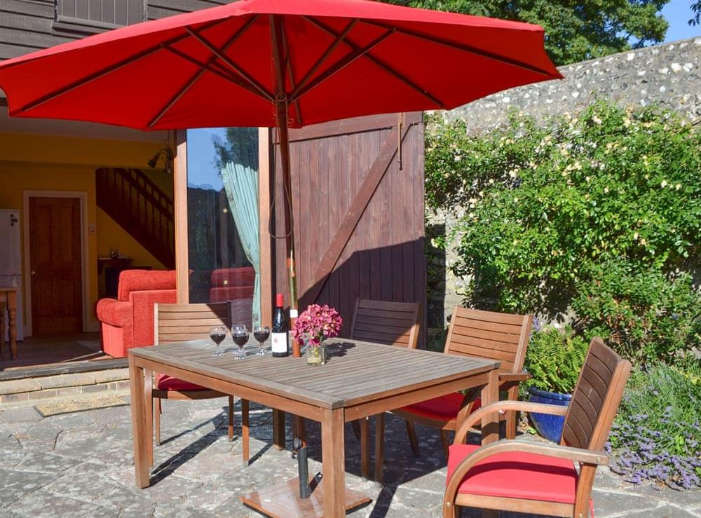 Outdoor furniture on patio at Darwin Cottage in Polegate, East Sussex