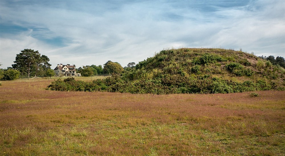 The Royal Burial Ground of Sutton Hoo with Tranmer House in the background, nr Woodbridge, Suffolk at Deben View in Woodbridge, Suffolk