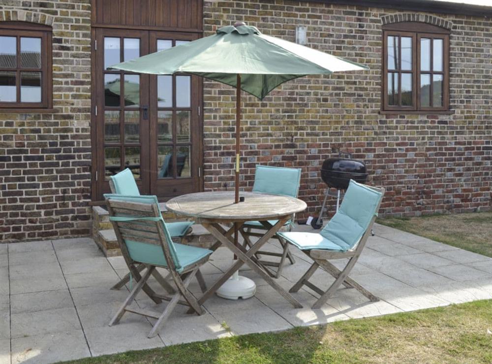 Attractive holiday home with patio and enclosed lawned garden at The Haybarn, 