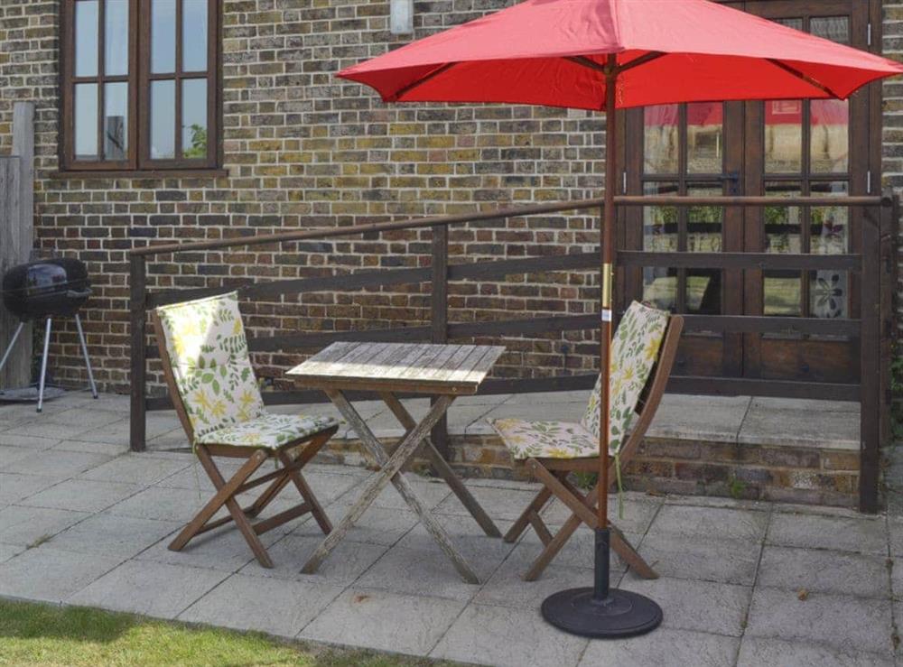Patio with outdoor furniture and BBQ at The Stable, 