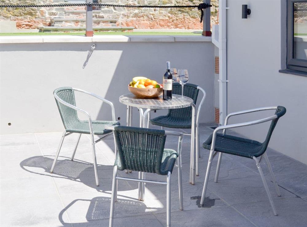 Patio area with outdoor furniture at Deepwater Point Apartment  in Torquay, Devon
