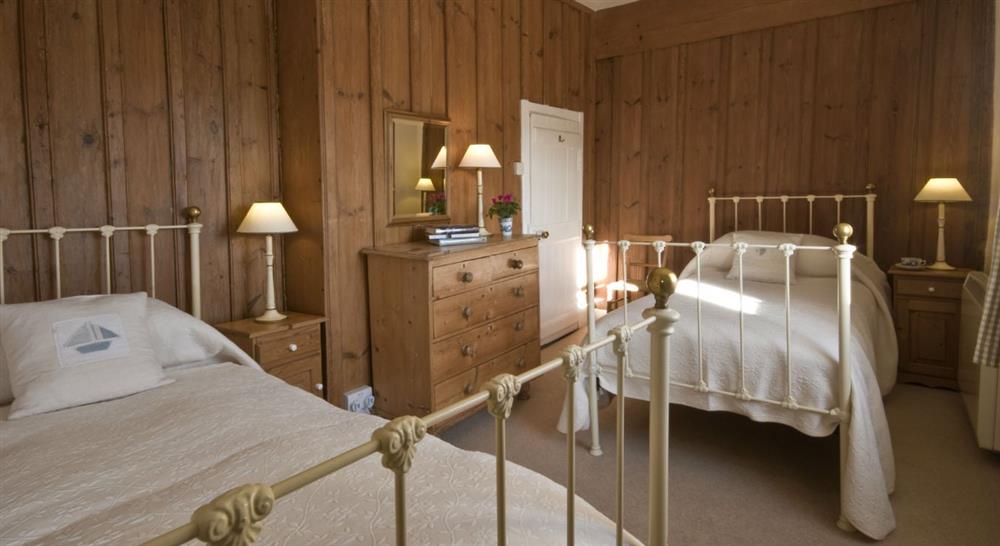 The twin bedroom at Degibna Lower Pentire Farm House in Helston, Cornwall